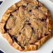 Blueberry Peach Rustic Tart on a white cake platter