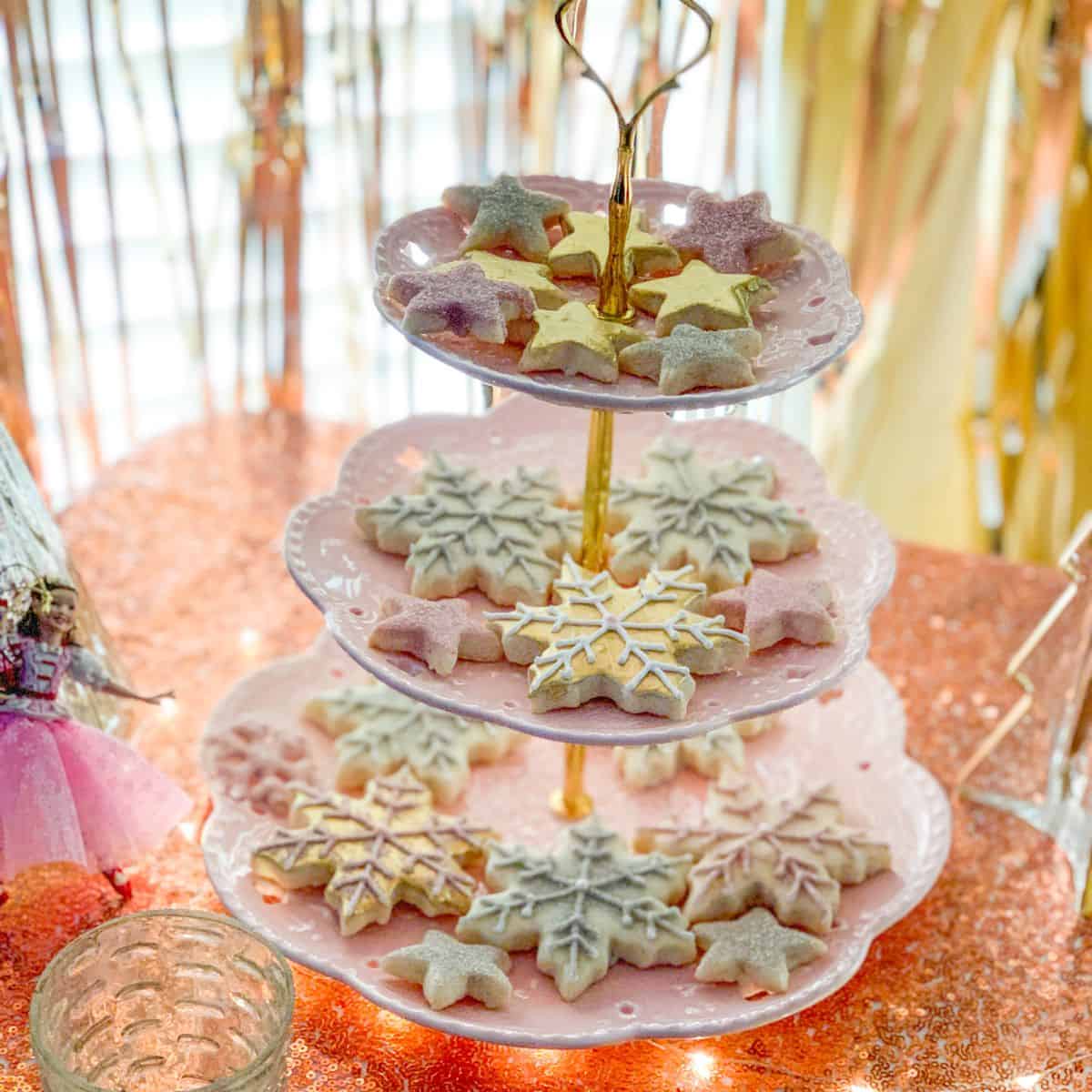 gold painted cookies on a 3-tiered server