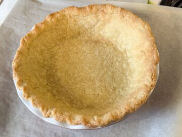 a single crust pie in a pie plate that has been par-baked