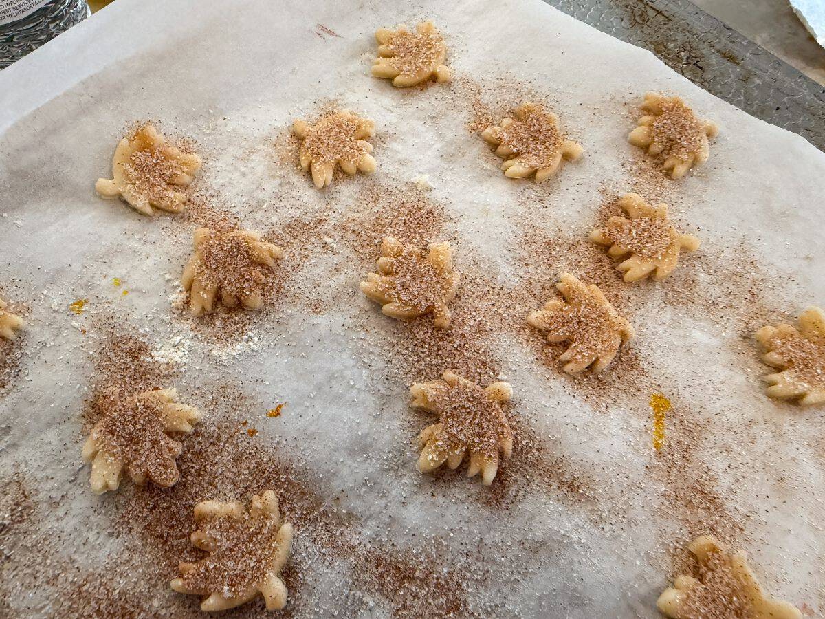 cinnamon sugar sprinkled over pie crust leaf shapes