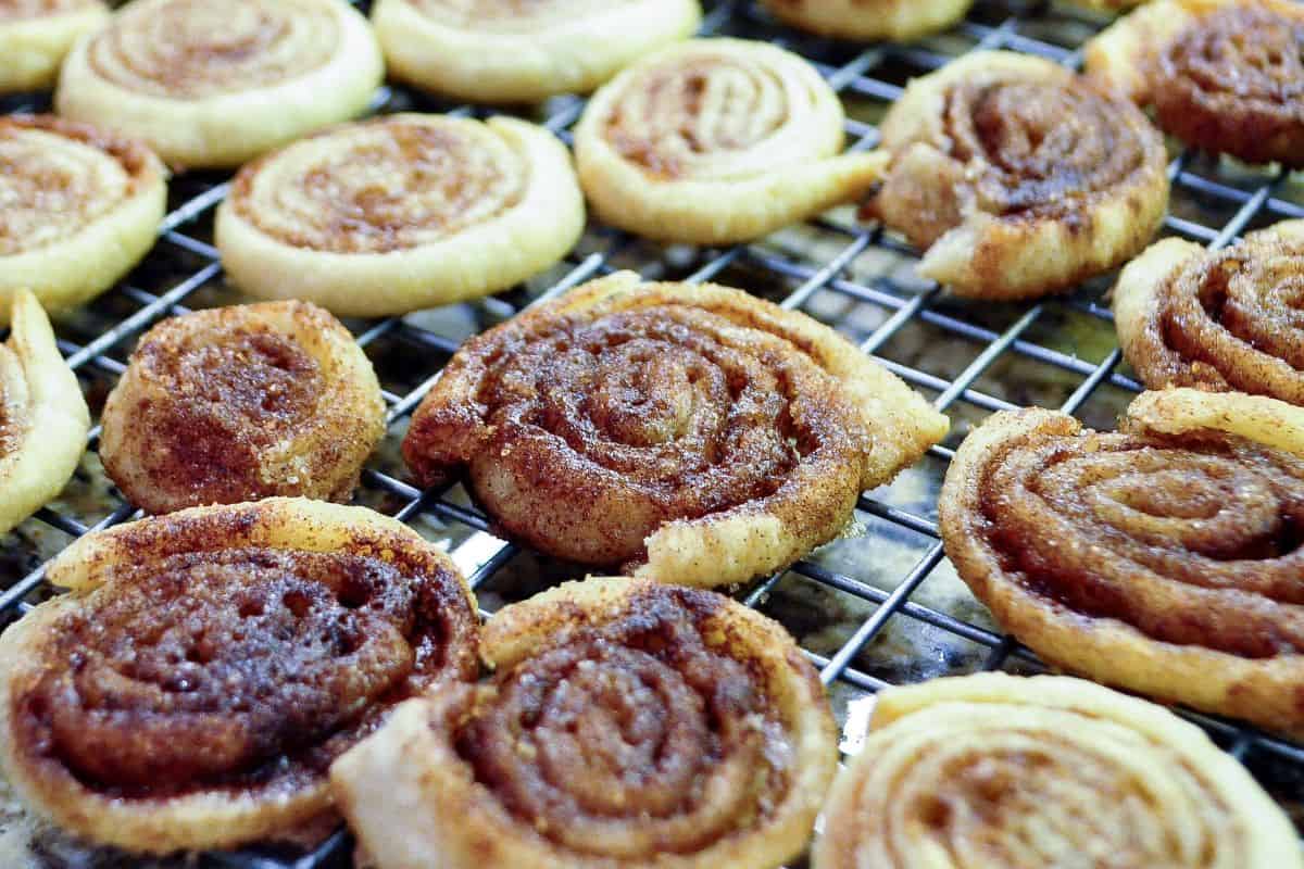 cinnamon sugar pie dough cookies on a cooling rack