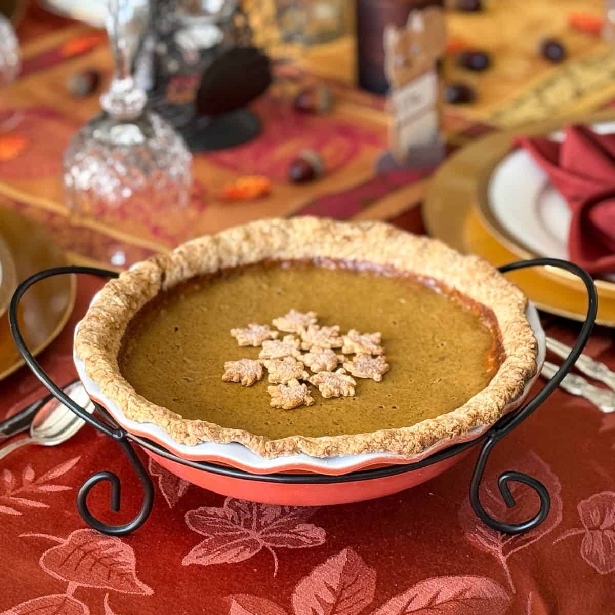 Rich Pumpkin Pie on a Thanksgiving table