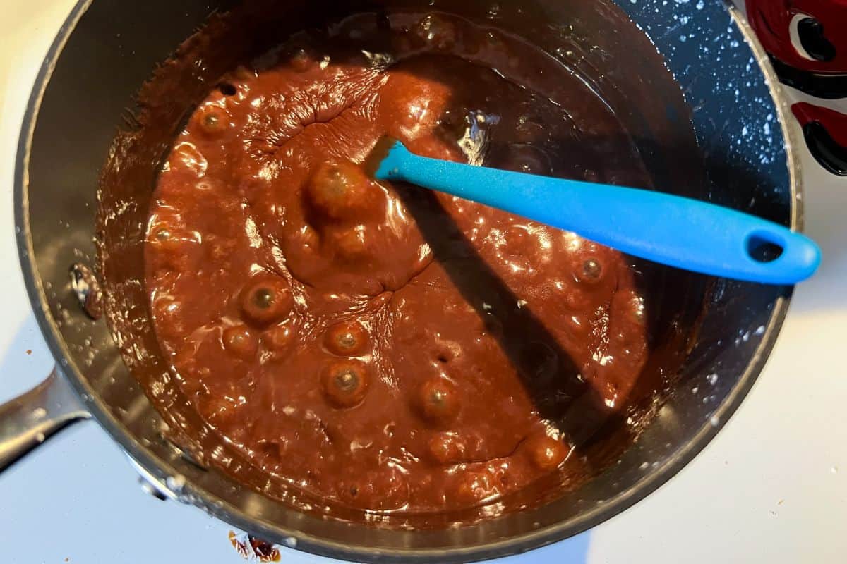 hot fudge sauce bubbling in a saucepan
