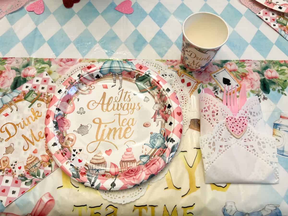 an Alice in Wonderland place setting on a table