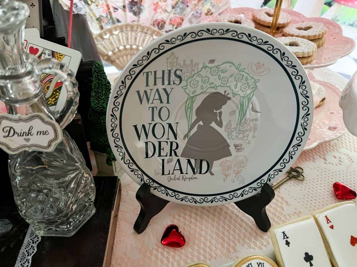 an Alice in Wonderland plate on a plate stand