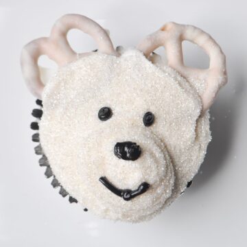 a polar bear cupcake on a white plate