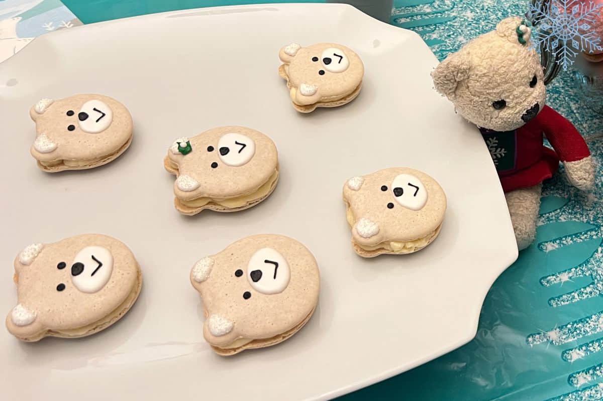 a stuffed polar bear next to polar bear macarons