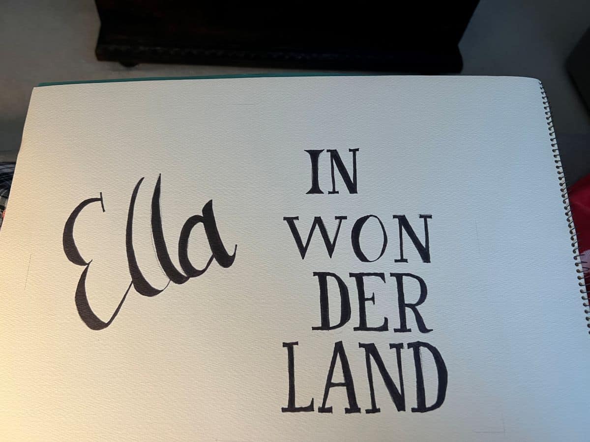 lettering for "Ella in Wonderland" on a sign
