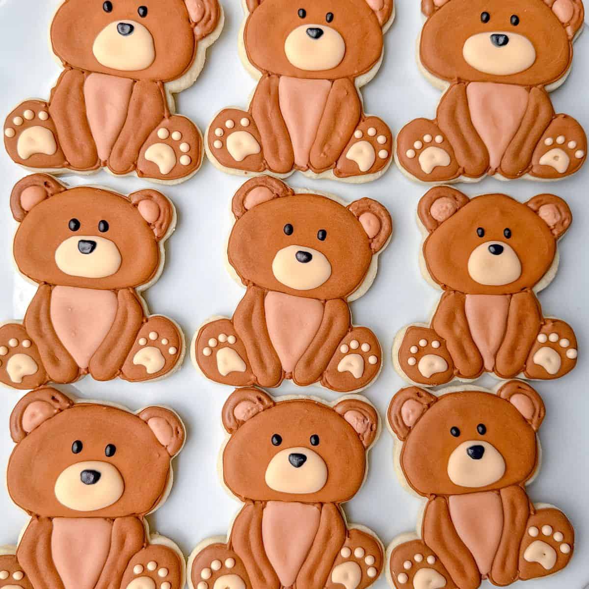 Teddy Bear Cookies with Royal Icing on a white plate