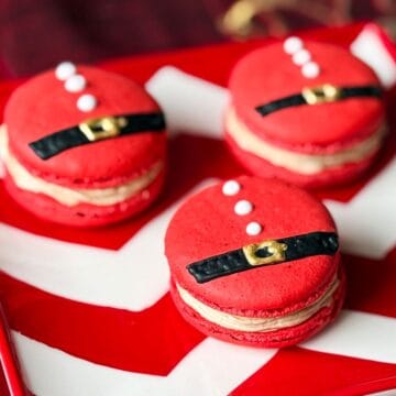 Nut Free Santa Macarons on a red and white chevron plate