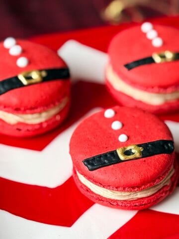 Nut Free Santa Macarons on a red and white chevron plate