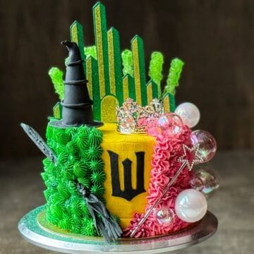 a Wicked Birthday Cake on a silver cake stand
