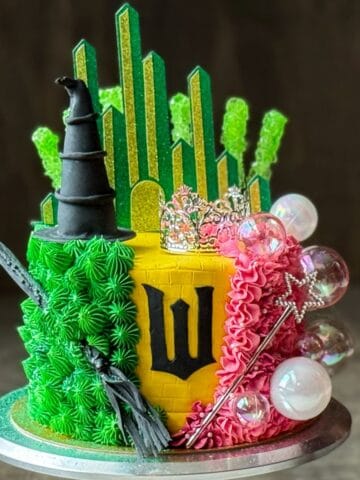 a Wicked Birthday Cake on a silver cake stand