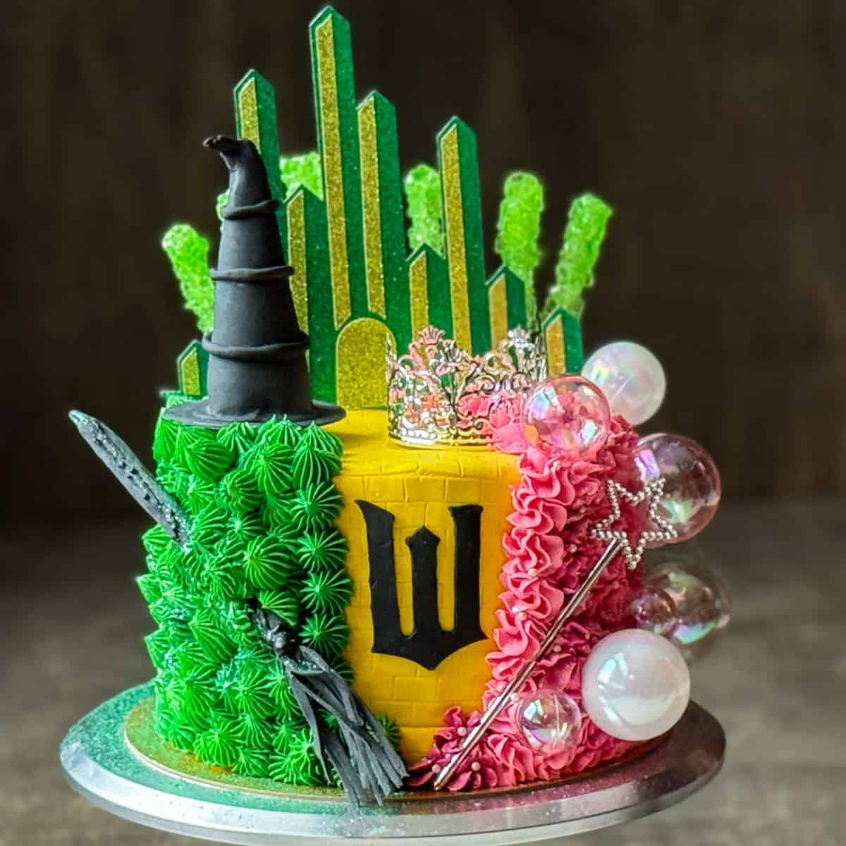 a Wicked Birthday Cake on a silver cake stand