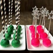 Wicked Cake Pops, which are a plate of green cake pops with black and white striped sticks and a plate of pink cake pops with silver star wand sticks