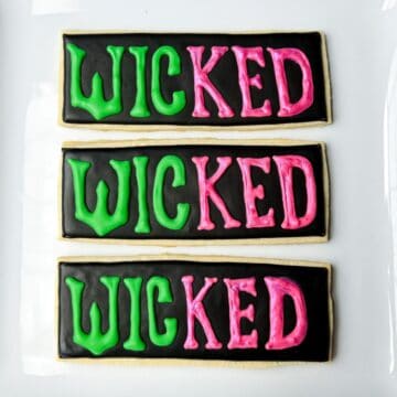Wicked Cookies decorated with royal icing on a white plate