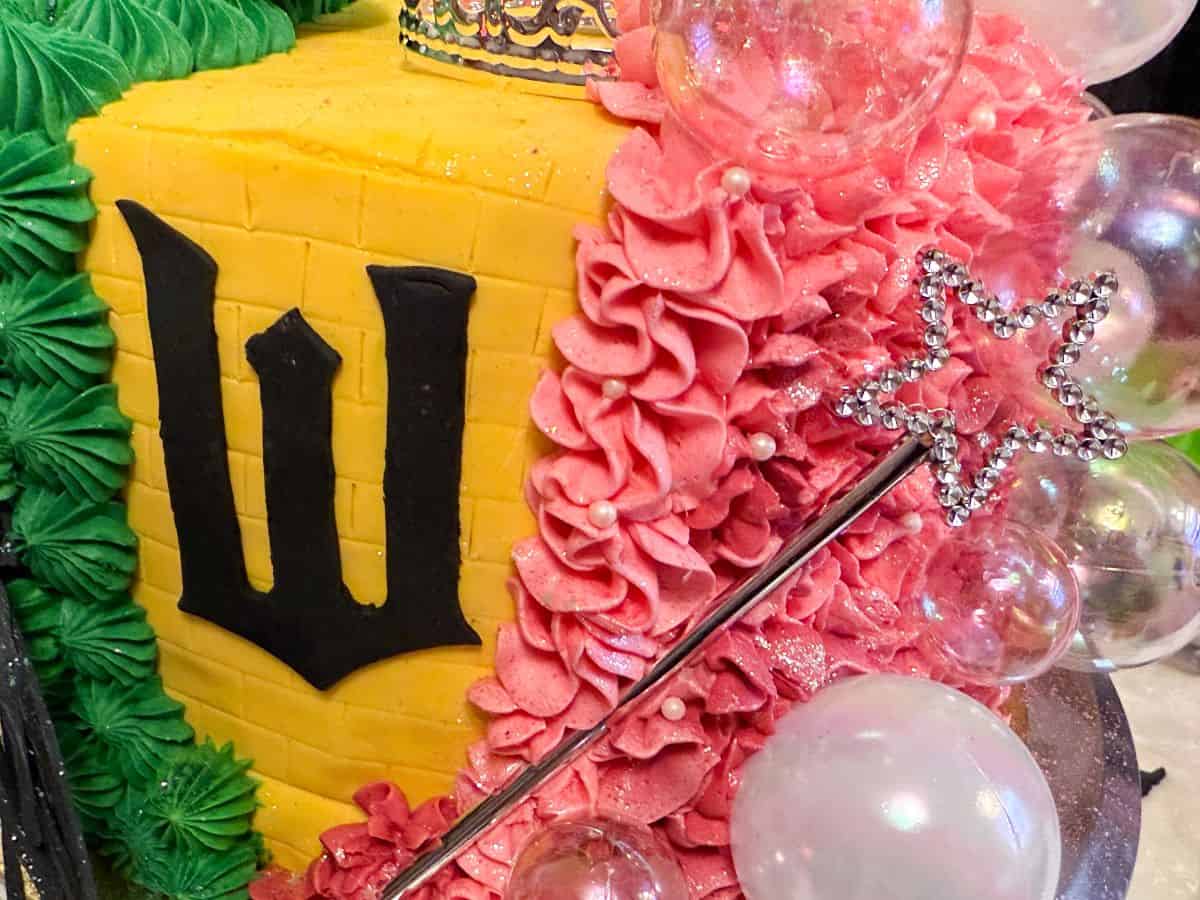 plastic silver wand pressed into a Wicked cake