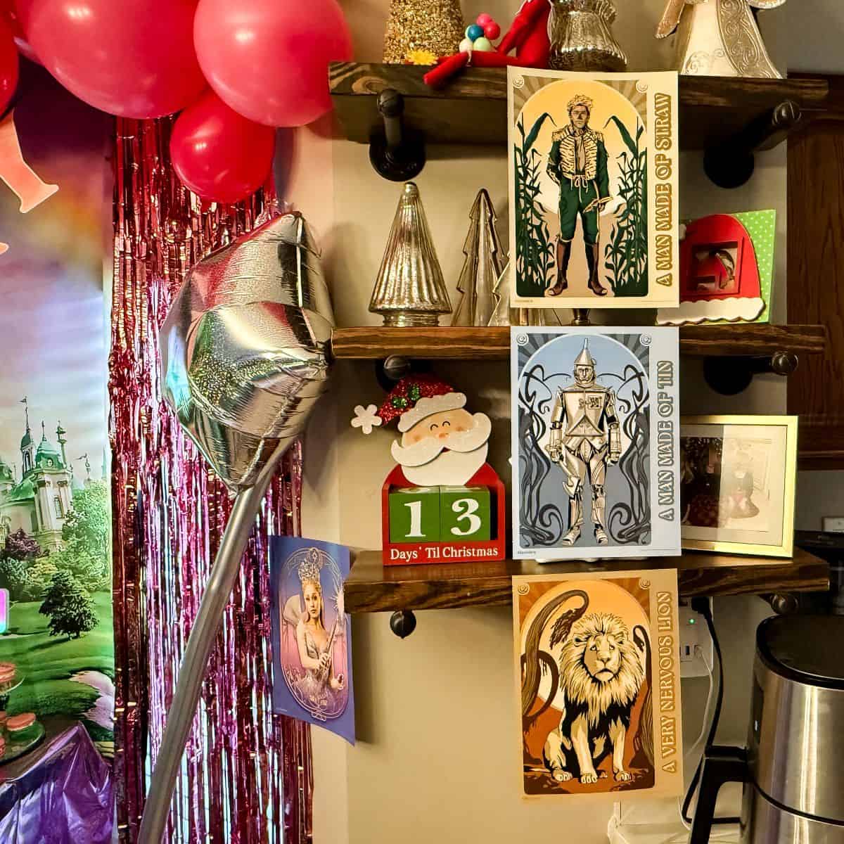Wizard of Oz posters hung an 3 shelves