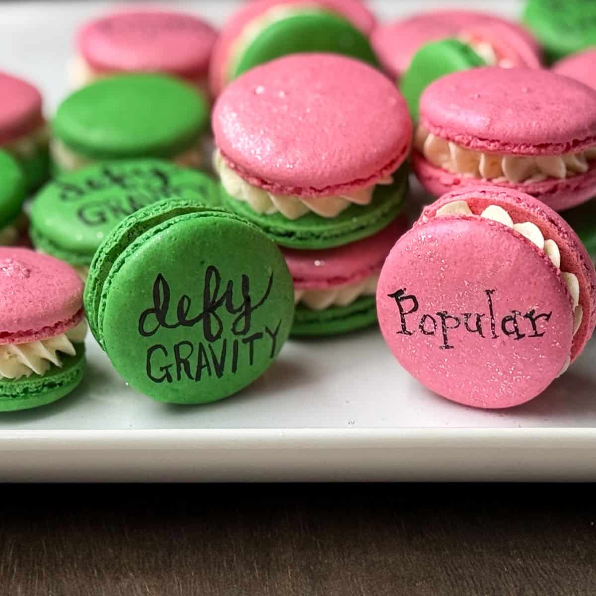 Wicked macarons with green and pink shells