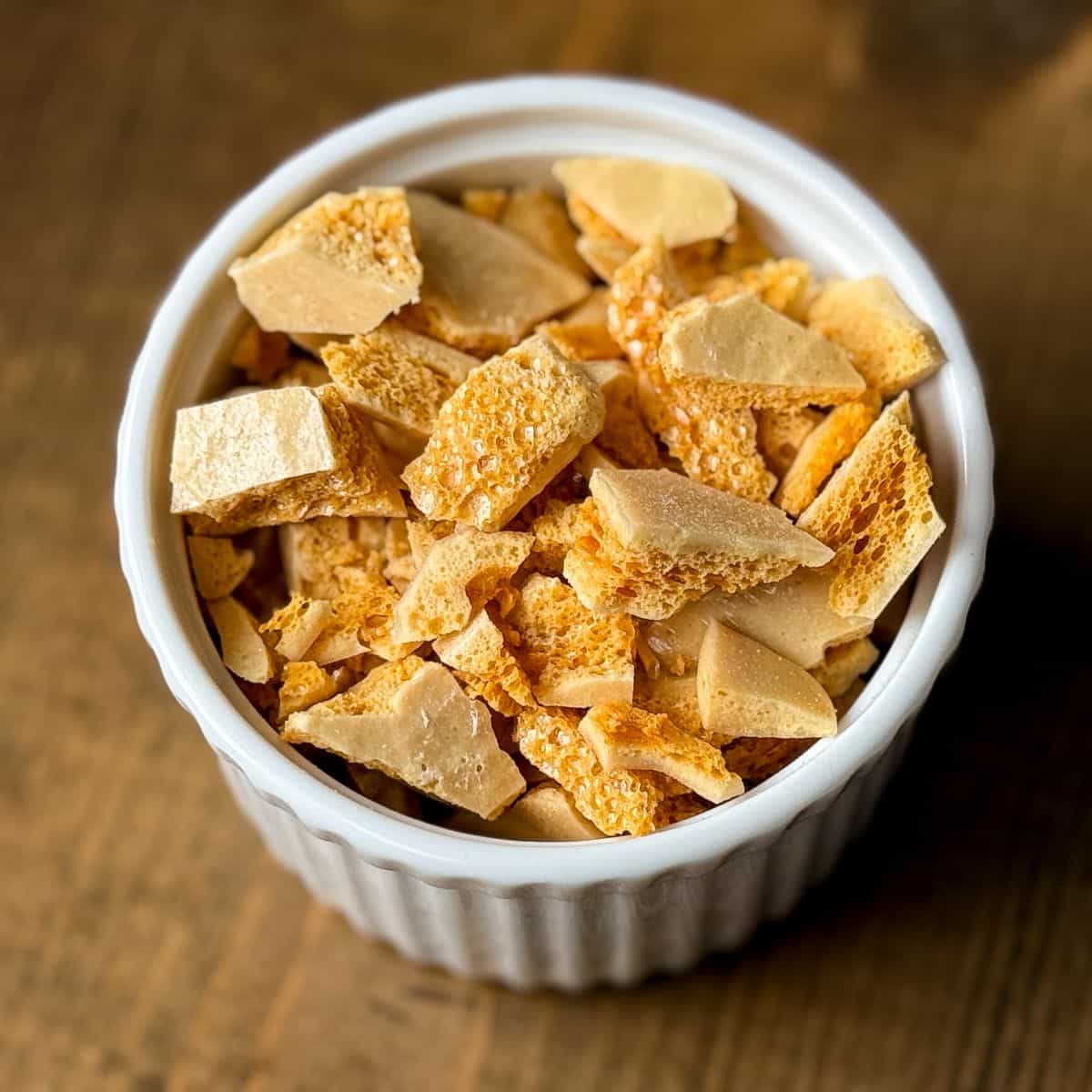 a white ramekin filled with Coffee Crunch Honeycomb Candy