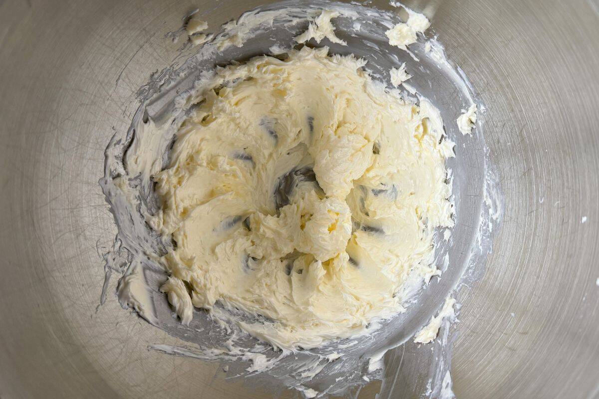 beaten butter in a metal mixing bowl