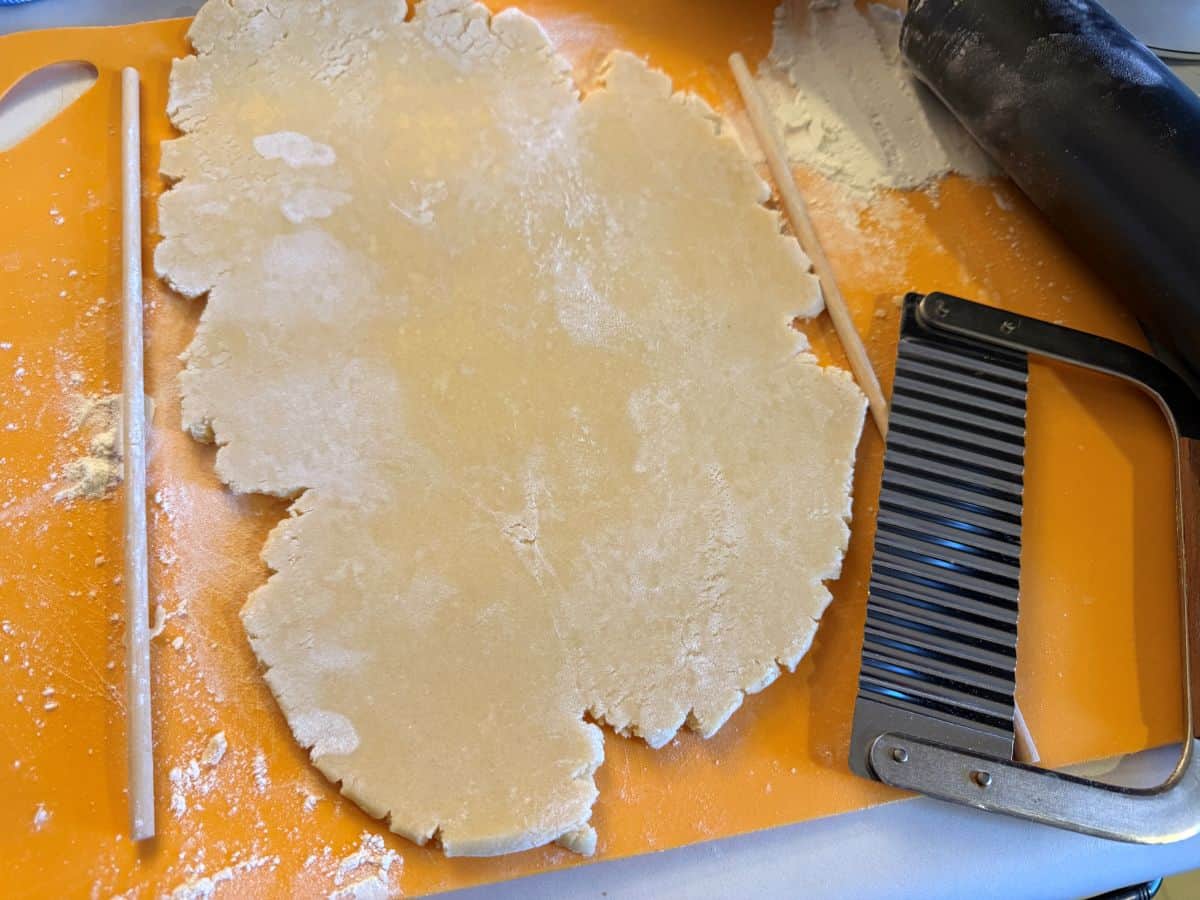 cookie dough rolled out on a mat