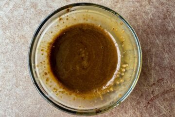 espresso powder dissolved in water in a small glass dish