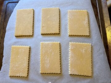 6 rectangular cookies on a parchment lined cookie sheet
