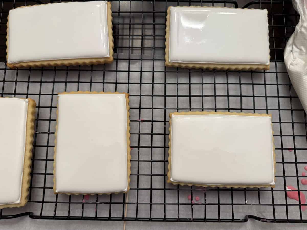 sugar cookies flooded with white royal icing