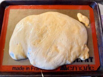 coffee crunch candy poured out on a silpat mat