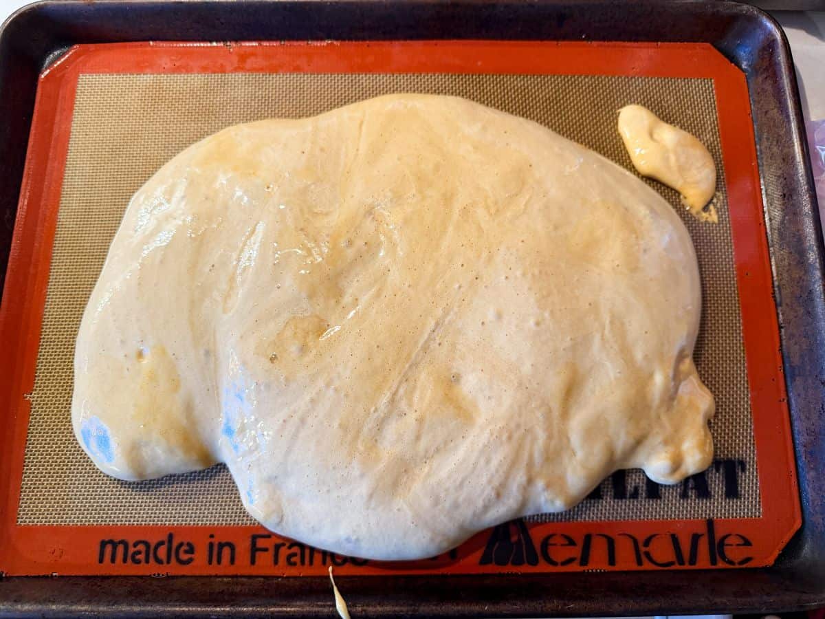 coffee crunch candy poured out on a silpat mat