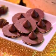 Easy Chocolate Wizard Hat Cookies stacked on a white plate