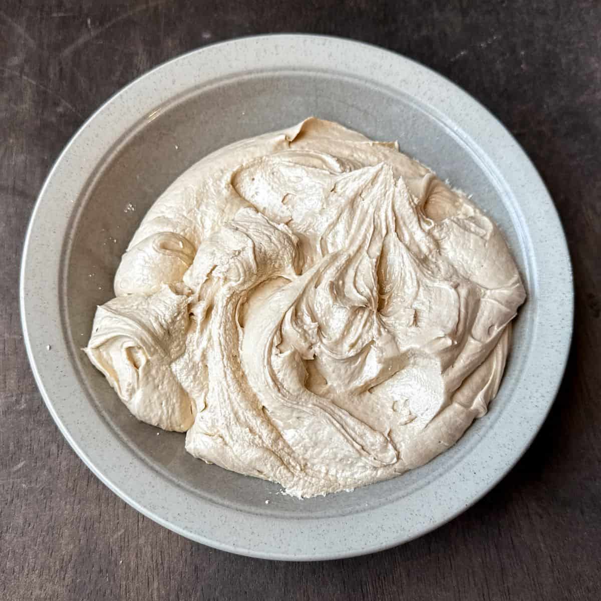 a bowl of homemade butterscotch buttercream