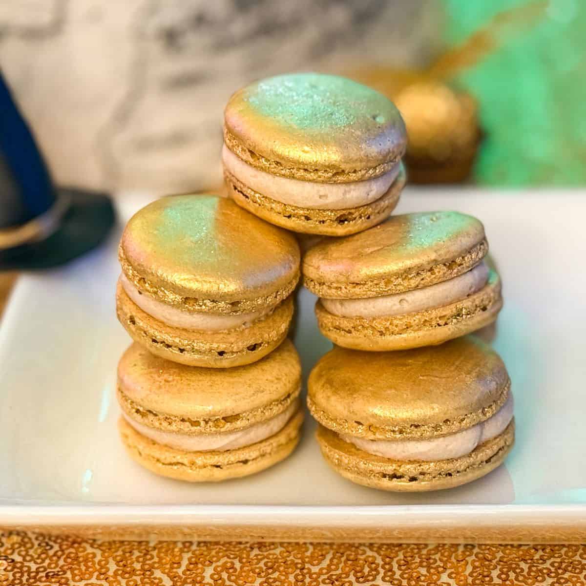 Nut Free Butterbeer Sorting Hat Macarons stacked on a white plate