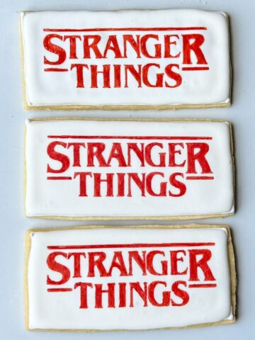 three Stranger Things Cookies on a white plate