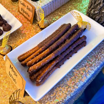 Wizard Wand Chocolate Pretzels stacked on a white plate