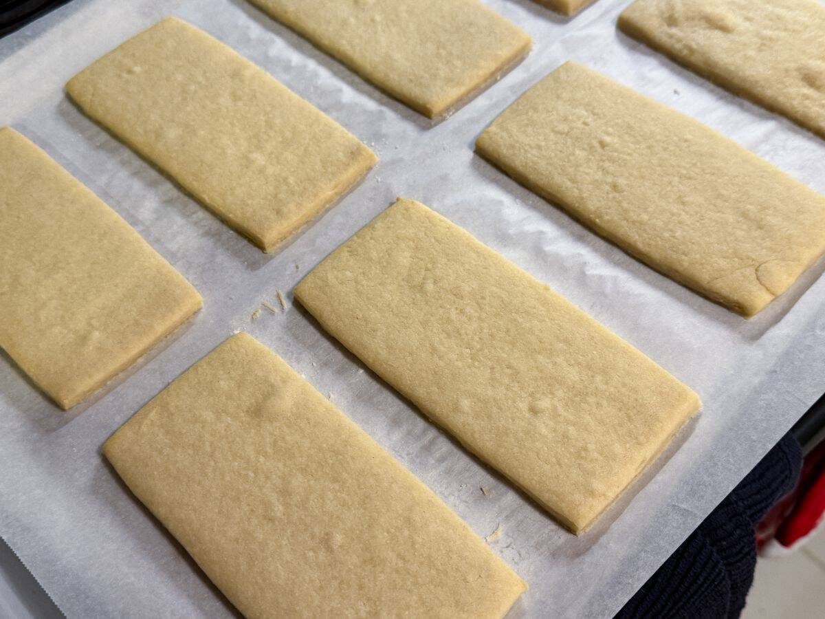 rectangular cookies baked on a parchment lined cookie sheet