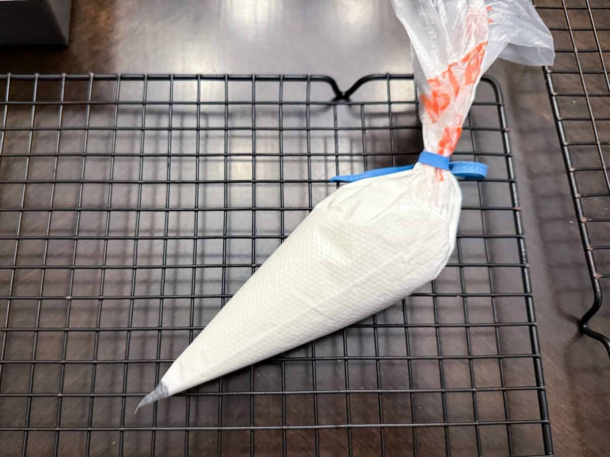 outline consistency royal icing in a disposable piping bag secured with a rubberband 