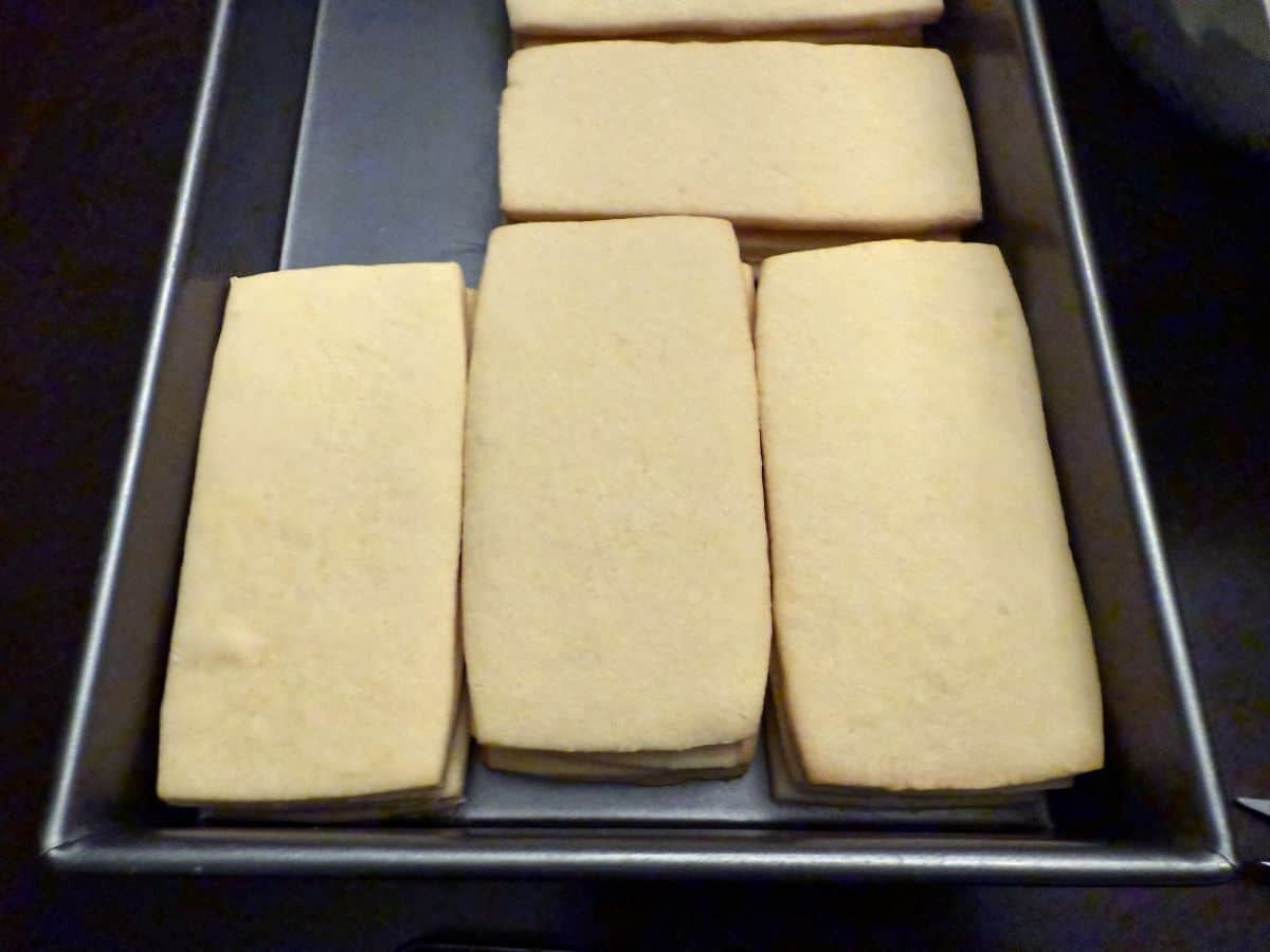 a cake pan filled with rectangular cookies
