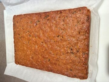 Date Bars baked and turned out onto a piece of parchment paper
