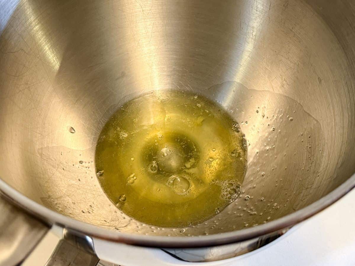 raw egg whites in a metal mixer bowl