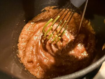 nut free toffee cooking in saucepan while being whisked