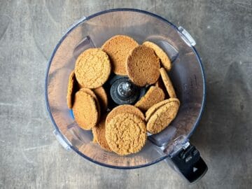 gingersnap cookies in the bowl of a food processor