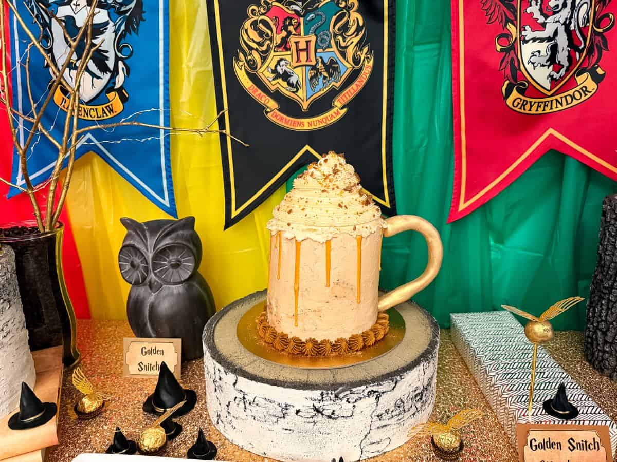 a Harry Potter Butterbeer Cake on a Harry Potter Dessert Table