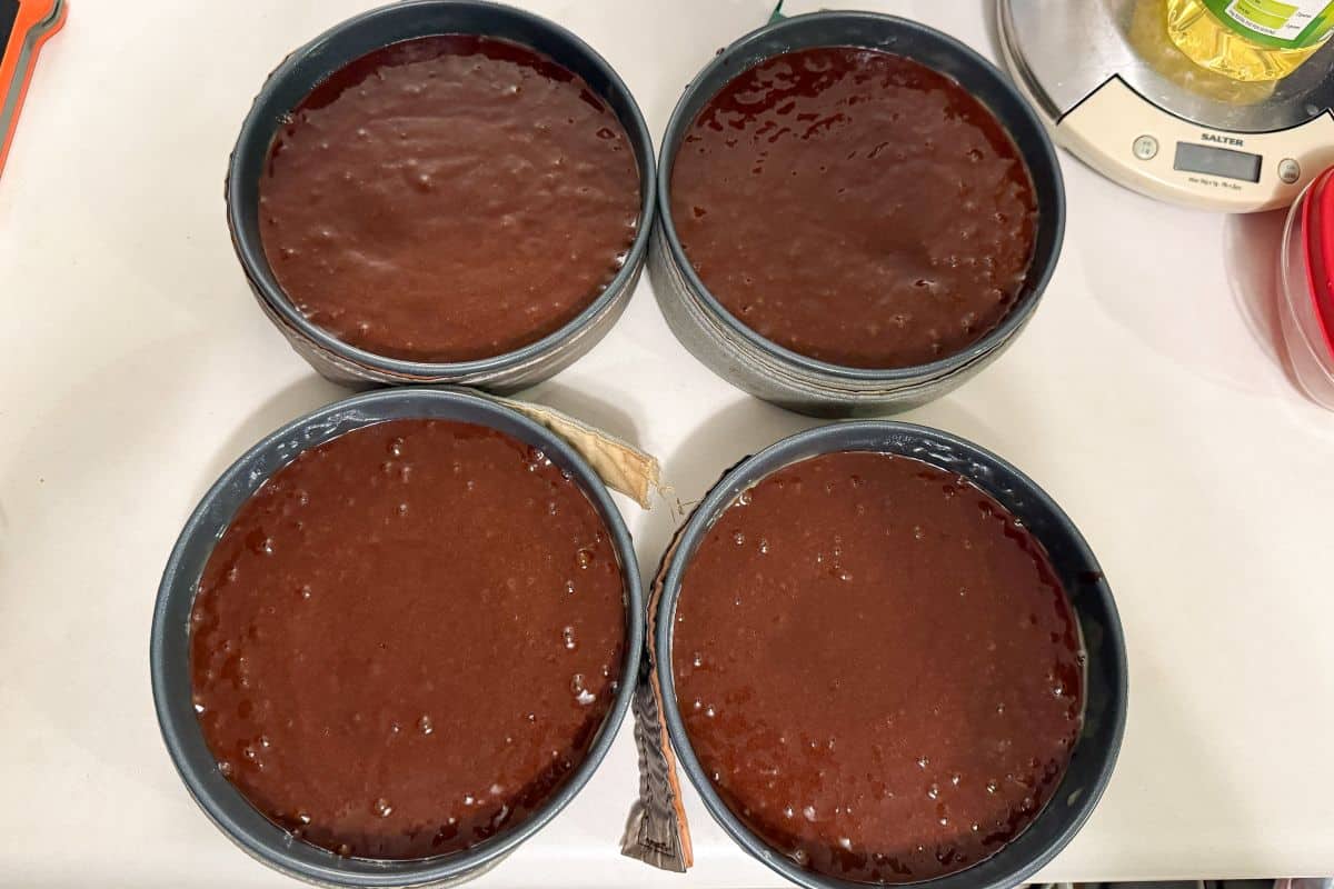 chocolate cake batter in 4 6-inch pans