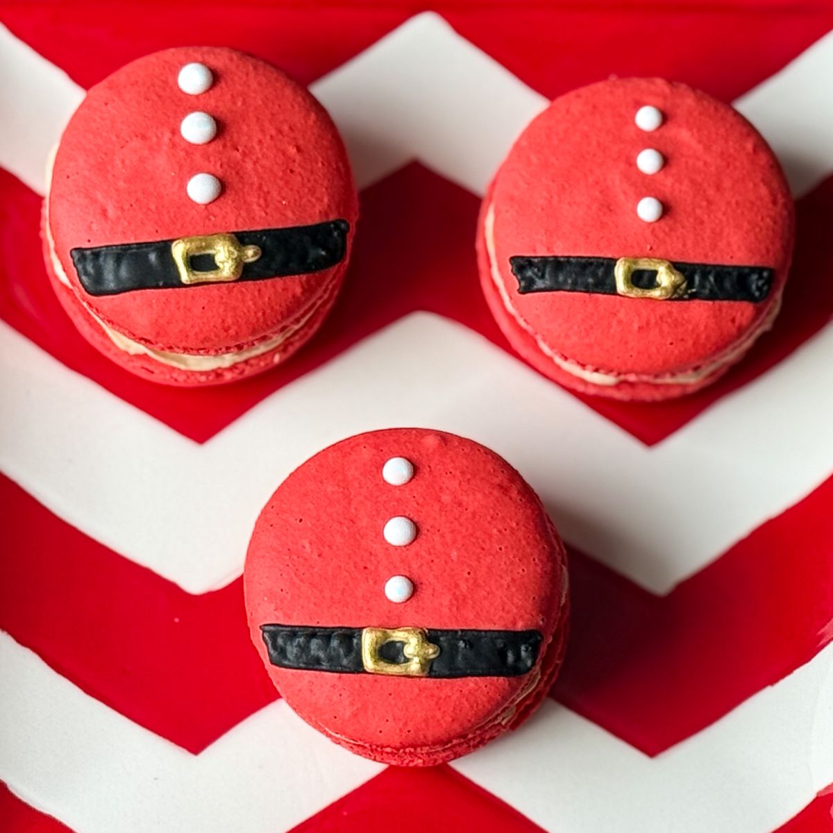 Nut Free Santa Macarons on a red and white chevron plate
