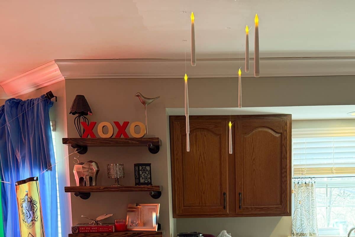 floating candles hanging from a kitchen ceiling