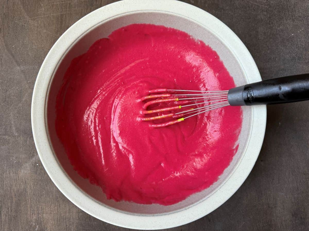 cranberry curd in a bowl after butter has been whisked in