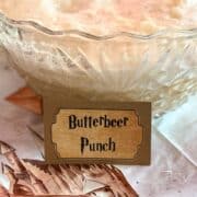 a punch bowl filled with punch labeled "Butterbeer Punch"