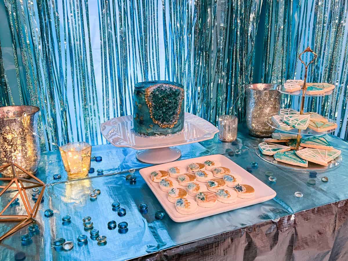 a gem and geode birthday party dessert table